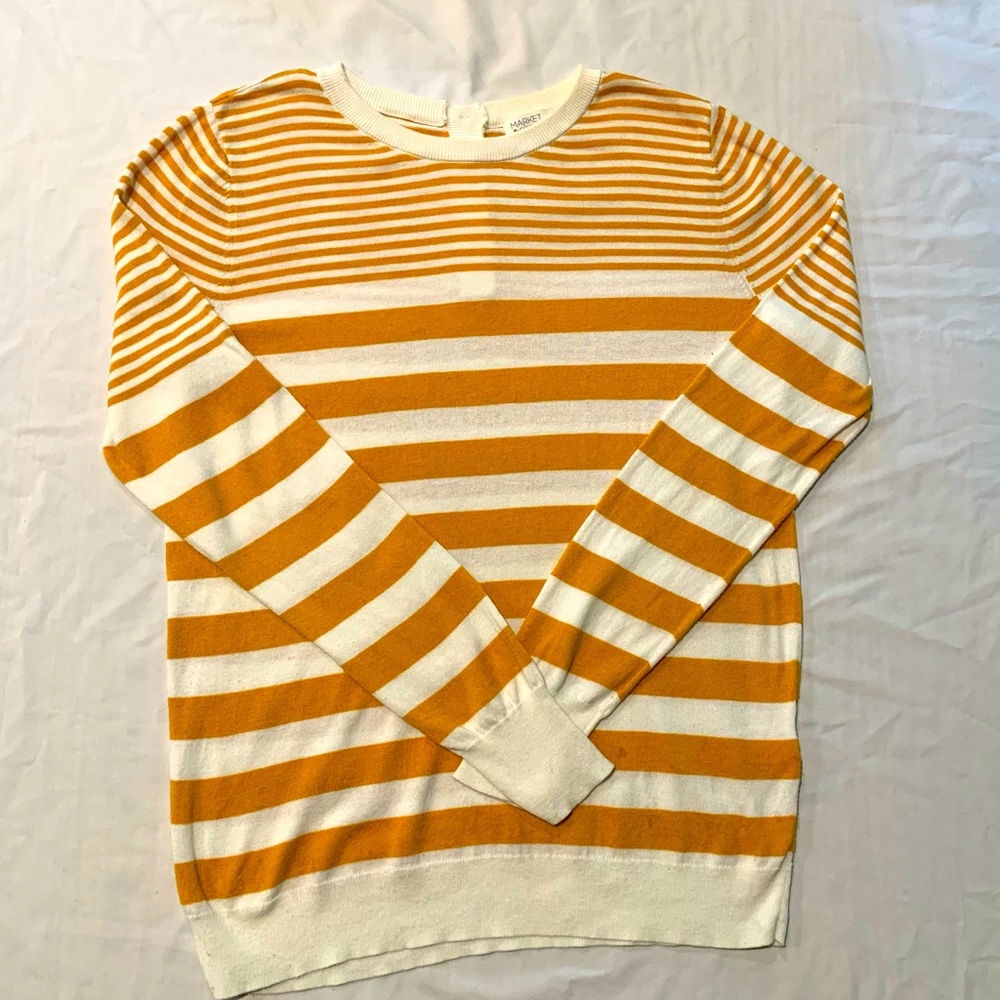 Light sweater with cute button closure in the back.